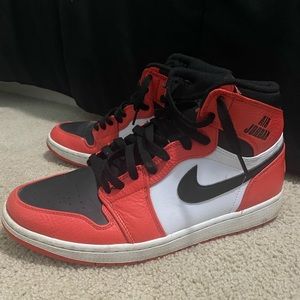 Black, orange and white air Jordan 1s